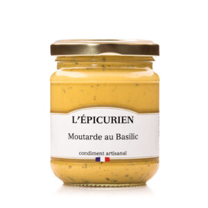 Photo d'une moutarde, présentée sur un fond blanc.