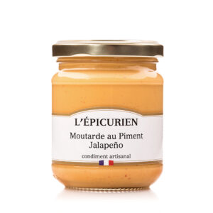 Photo d'une moutarde, présentée sur un fond blanc.