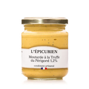 Photo d'une moutarde, présentée sur un fond blanc.