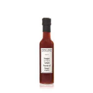 Photo d'un vinaigre, présentée sur un fond blanc. Parfait en accompagnement d'un plat.
