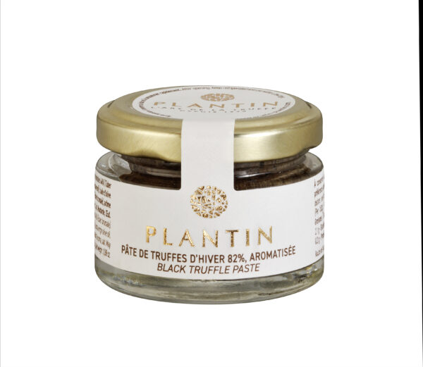 Photo d'un pot de truffe, présenté sur un fond blanc.