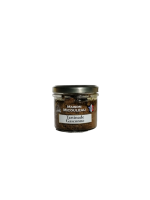 Photo d'une tartinade, présentée sur un fond blanc. Parfait en accompagnement d'un apéritif.