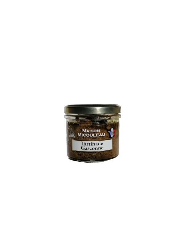 Photo d'une tartinade, présentée sur un fond blanc. Parfait en accompagnement d'un apéritif.