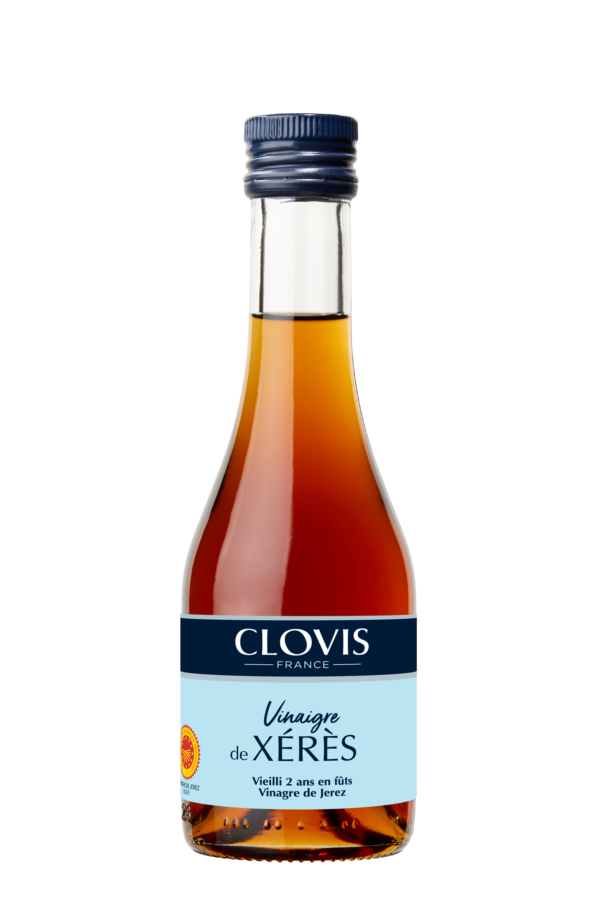 Photo d'un vinaigre, présentée sur un fond blanc. Parfait en accompagnement d'un plat.